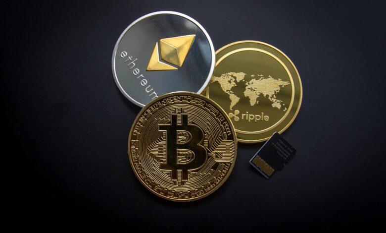 A striking image of Bitcoin, Ethereum, and Ripple coins illustrating modern digital currency.