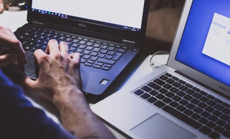 person using black laptop computer