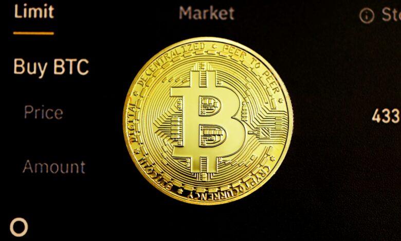 gold round coin on black surface